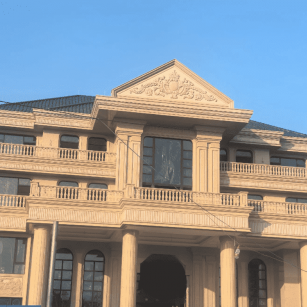 大庆黄金麻别墅外墙干挂石材效果示例